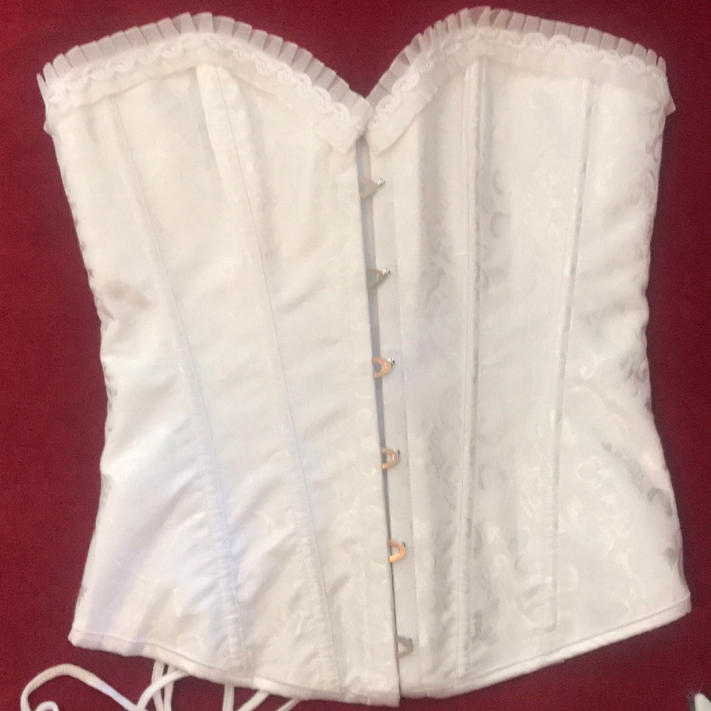 White corset with trim and boning.